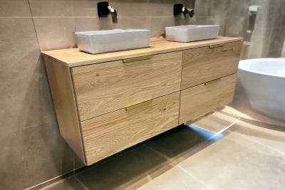 Modern floating wooden vanity with twin vessel sinks and mirrors