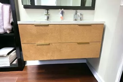 Contemporary floating vanity in wood finish with dual handles and mirror