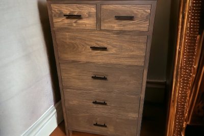Tall wooden dresser with five drawers