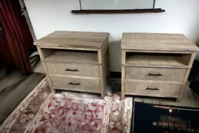 Two matching wooden bedside tables with drawers