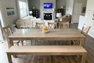 Wooden farmhouse  table with bench in modern home