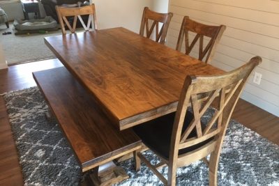 Rustic wooden dining table with matching chairs