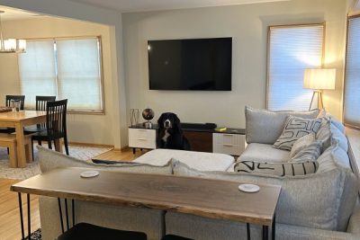 Cozy living space with a sofa, live oak end table and stool seating