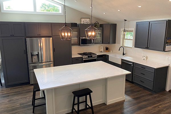 kitchen_9960 Modern kitchen with dark cabinets and an island